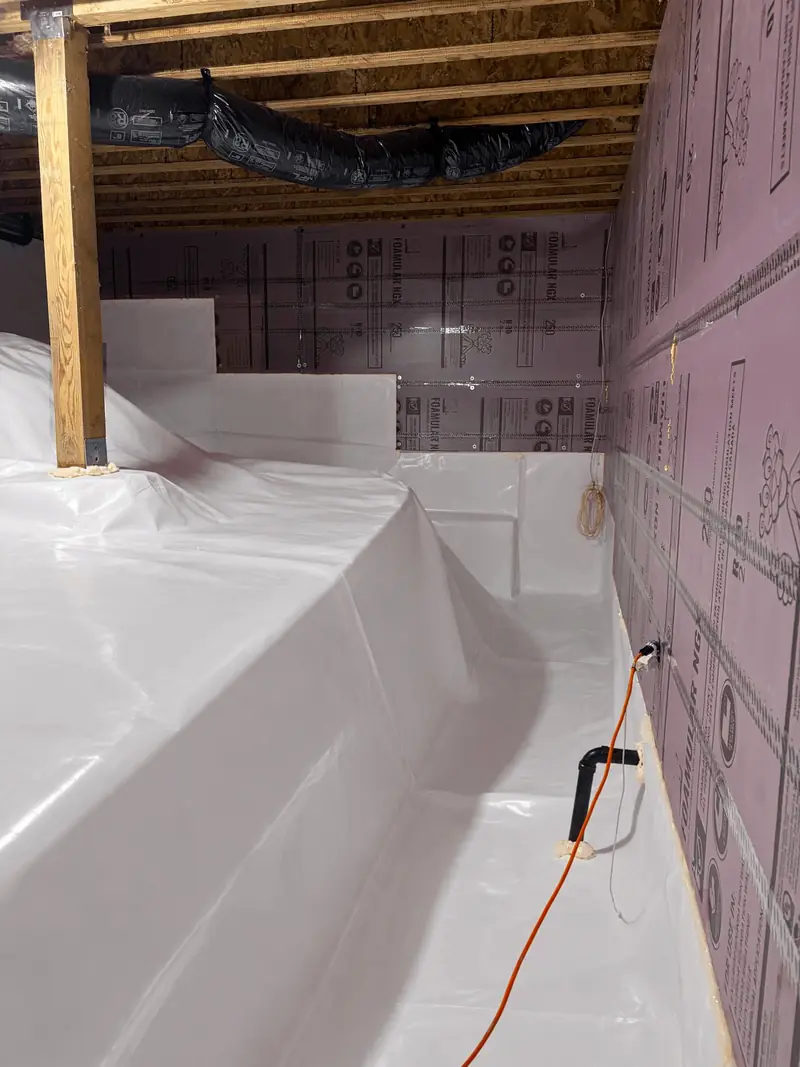 Liner sealed up insulated foundation walls in a finished crawl space